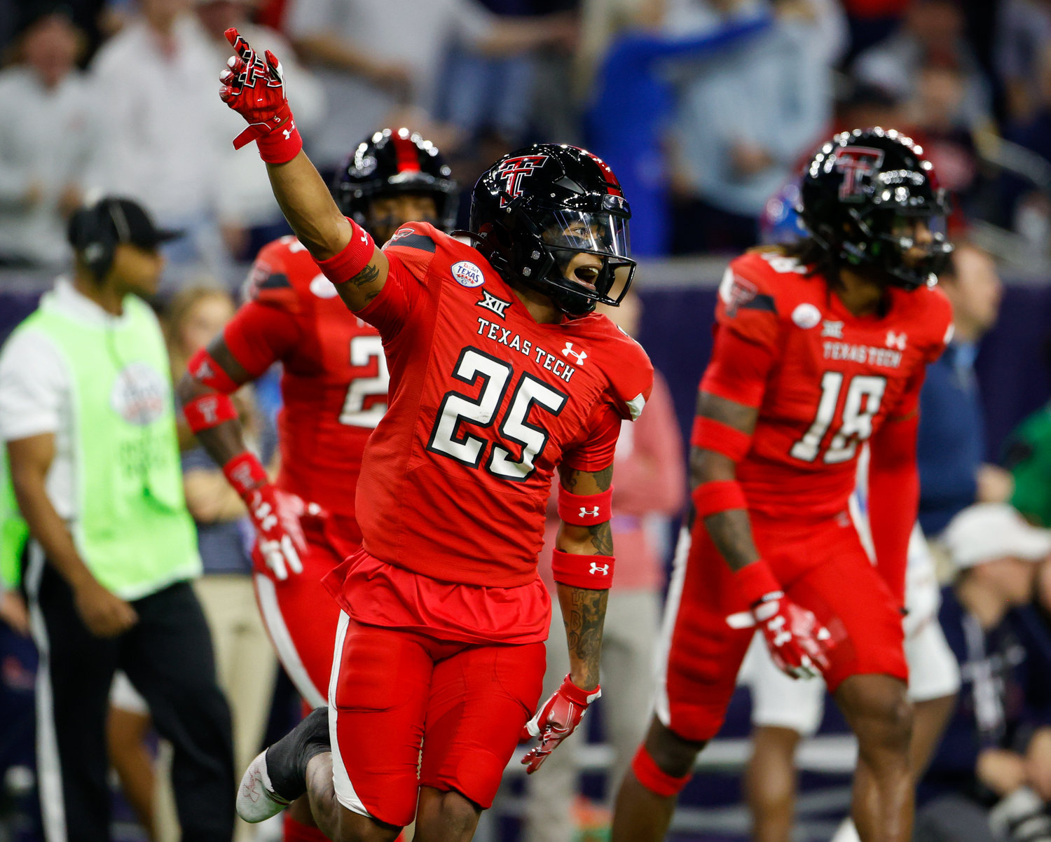 Texas Tech defensive back Dadrion Taylor-Demerson (25) celebrates after a defensive stop on fourth down during the TaxAct Texas Bowl on Dec. 28, 2022 in Houston.