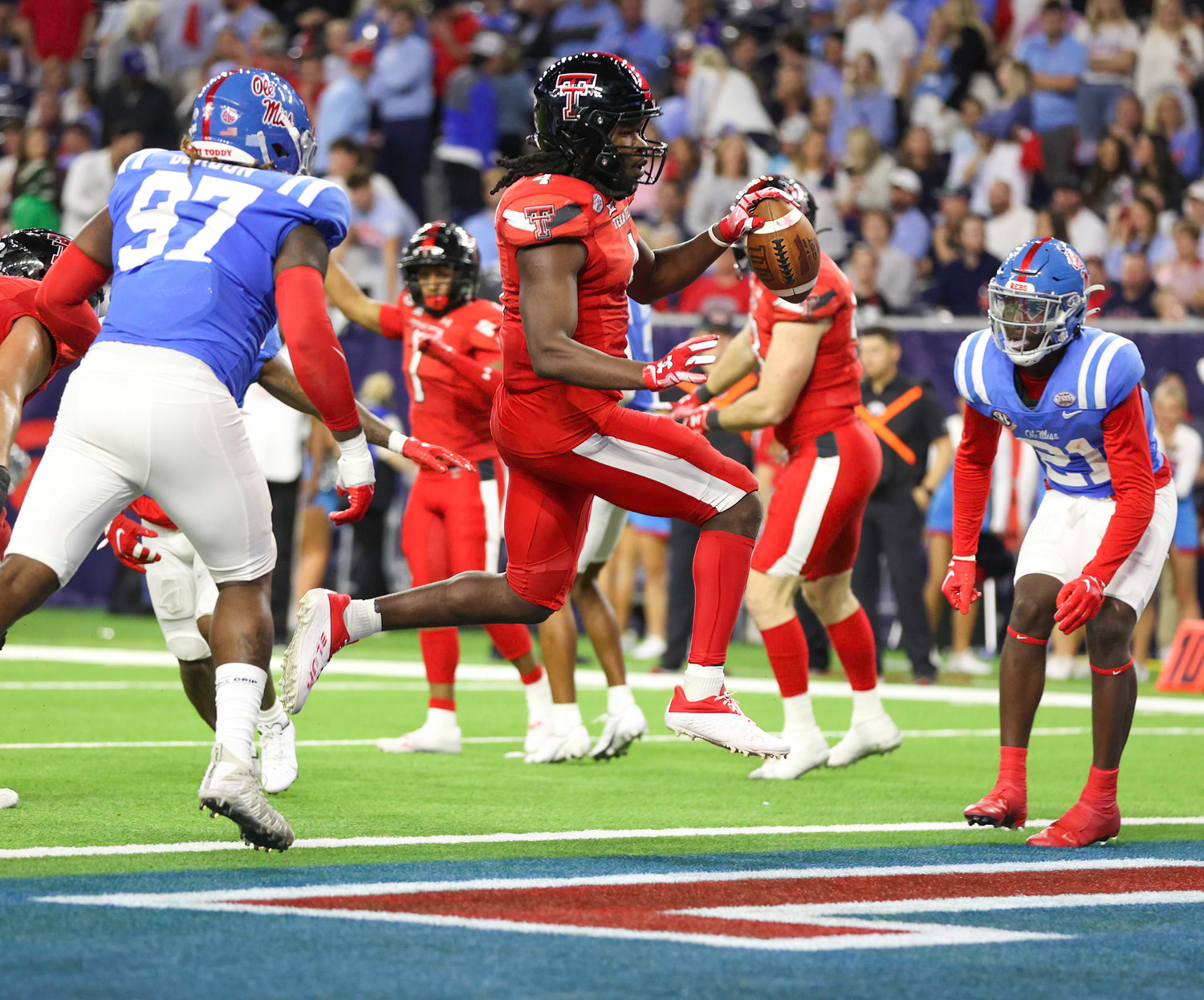 Texas Tech wide receiver Myles Price (1) leaps into the end zone to score a touchdown during the TaxAct Texas Bowl on Dec. 28, 2022 in Houston.