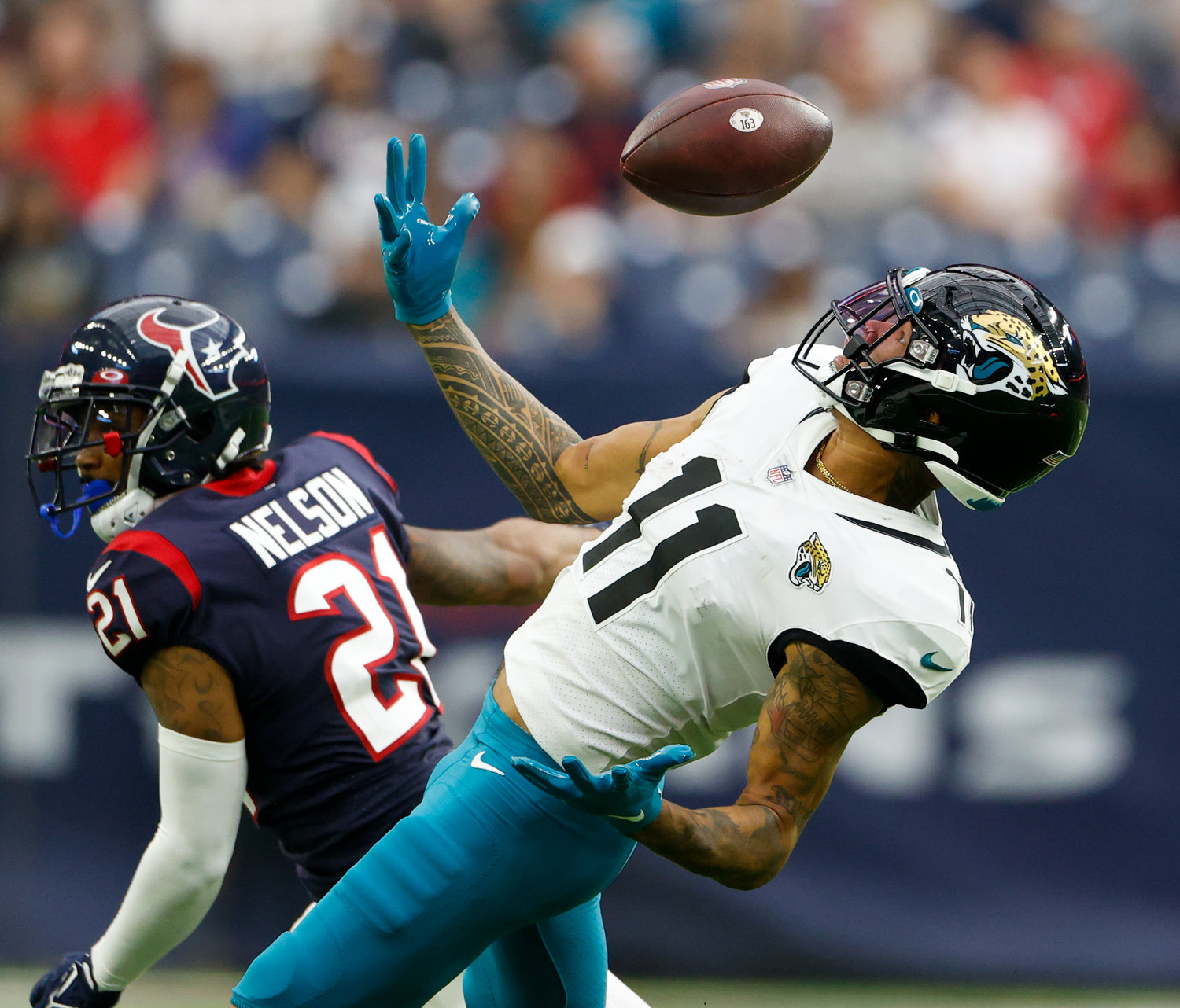 Jaguars wide receiver Marvin Jones Jr. (11) catches a pass he tipped into the air during an NFL game between the Houston Texans and the Jacksonville Jaguars on Jan. 1, 2023 in Houston. The Jaguars won, 31-3.