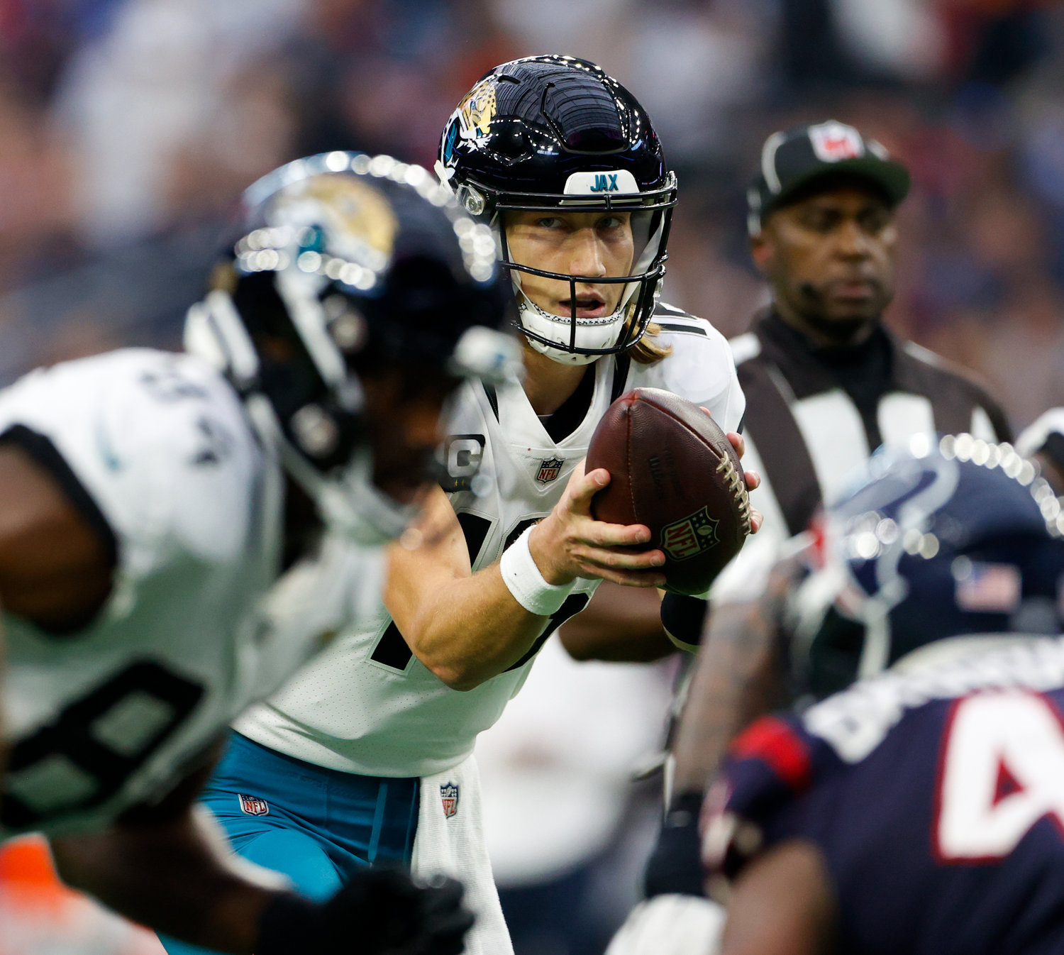 Jaguars quarterback Trevor Lawrence (16) takes the snap during an NFL game between the Houston Texans and the Jacksonville Jaguars on Jan. 1, 2023 in Houston. The Jaguars won, 31-3.