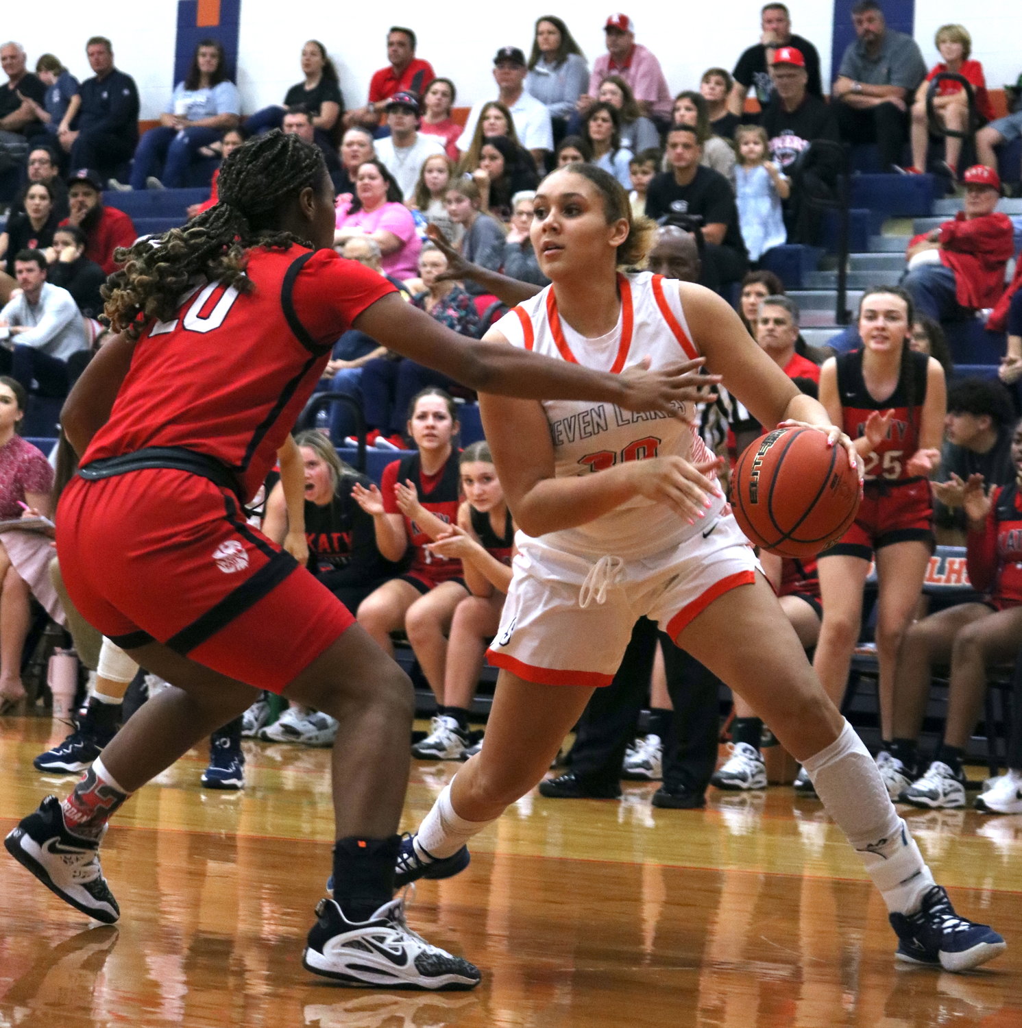 Justice Carlton drives baseline during Tuesday's game between Katy and Seven Lakes at the Seven Lakes gym.