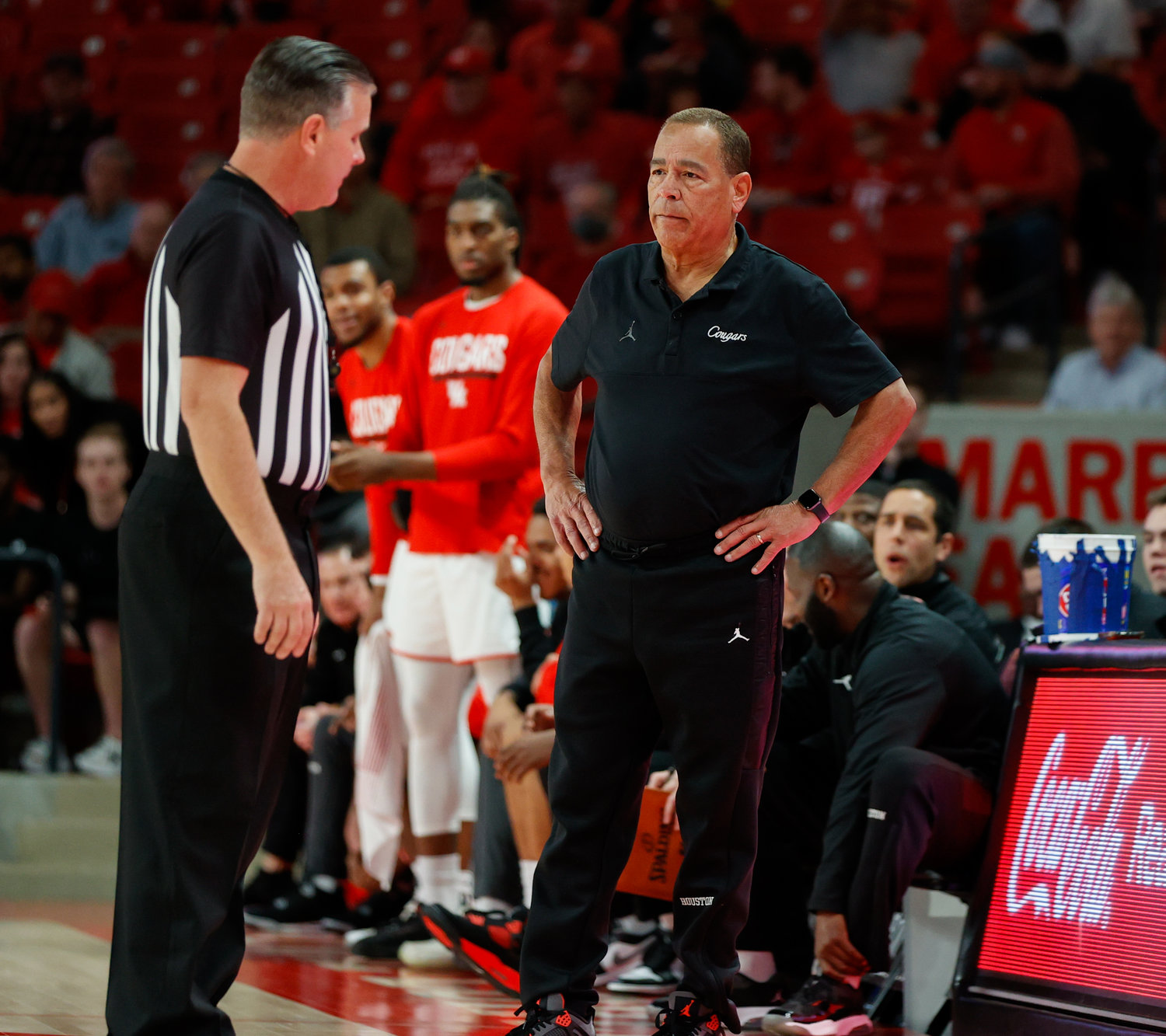 Houston head coach Kelvin Sampson talks with a game official during an NCAA men’s basketball game between the Houston Cougars and the Southern Methodist Mustangs on Jan. 5, 2023 in Houston. Houston won, 87-53,