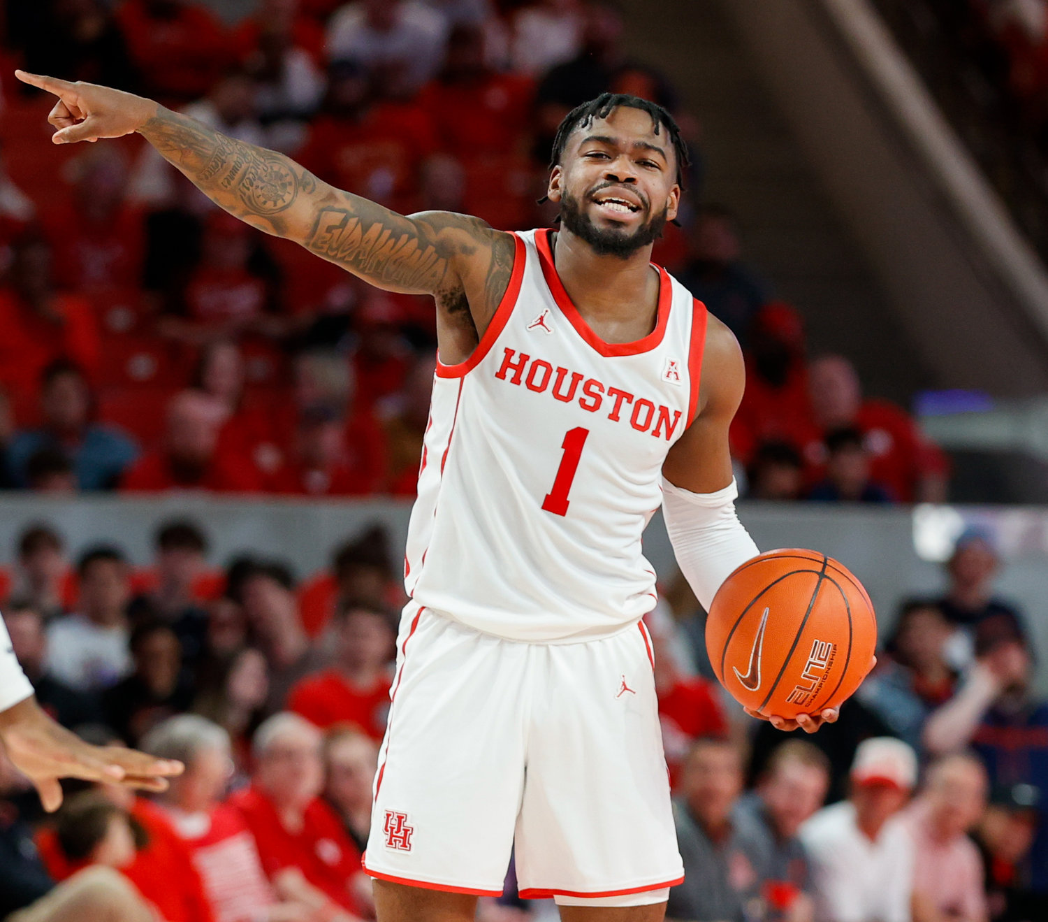 Houston guard Jamal Shead (1) gestures to his teammates during an NCAA men’s basketball game between the Houston Cougars and the Southern Methodist Mustangs on Jan. 5, 2023 in Houston. Houston won, 87-53,