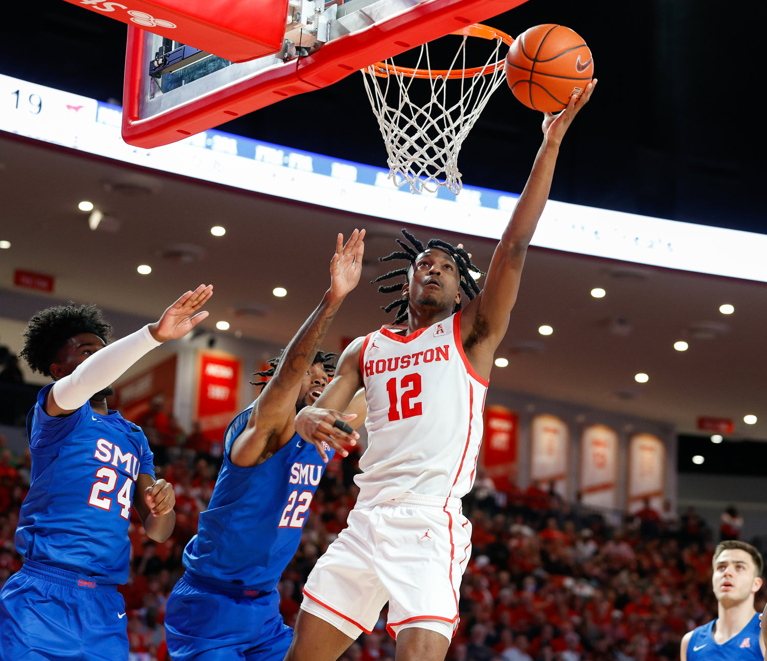 Houston guard Tramon Mark (12) goes to the basket during an NCAA men’s basketball game between the Houston Cougars and the Southern Methodist Mustangs on Jan. 5, 2023 in Houston. Houston won, 87-53,