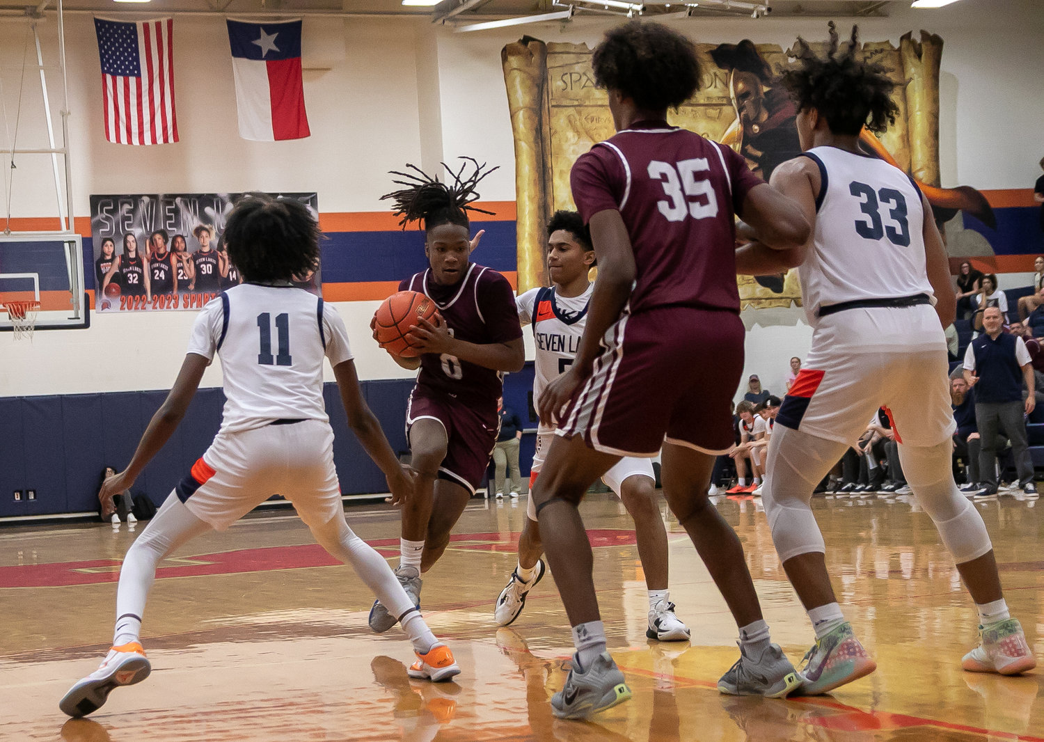 Prince Jones Bynum drives through the Seven Lakes defense during Saturday's game between Seven Lakes and Cinco Ranch at the Seven Lakes gym.