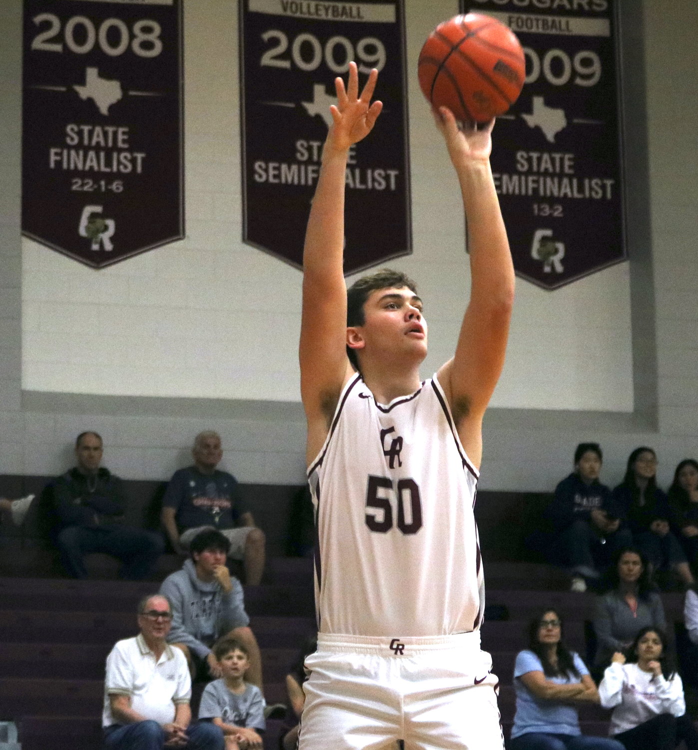 Harrison Moore shoots a jump shot during Wednesday's game between Cinco Ranch and Taylor at the Cinco Ranch gym.