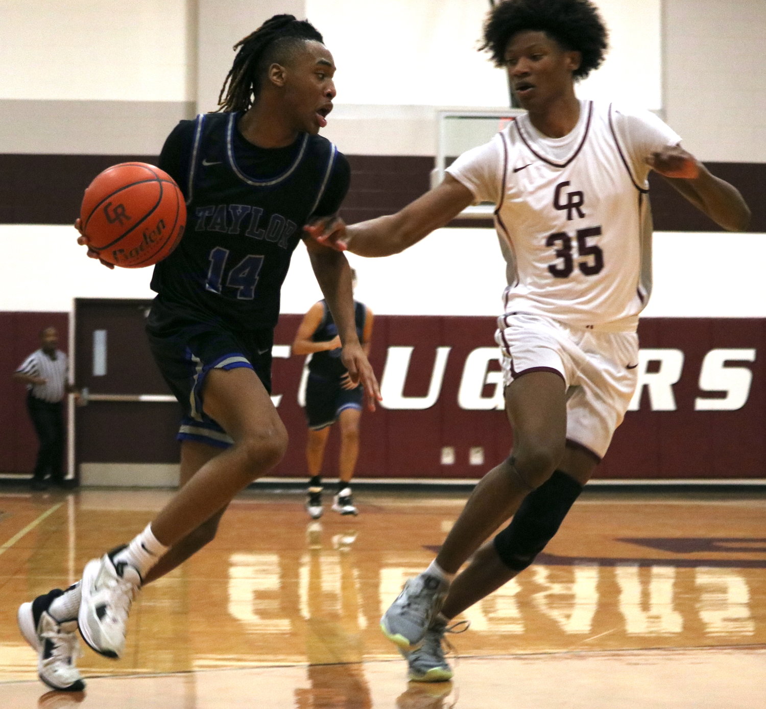 Jabari Parker drives towards the basket during Wednesday's game between Cinco Ranch and Taylor at the Cinco Ranch gym.