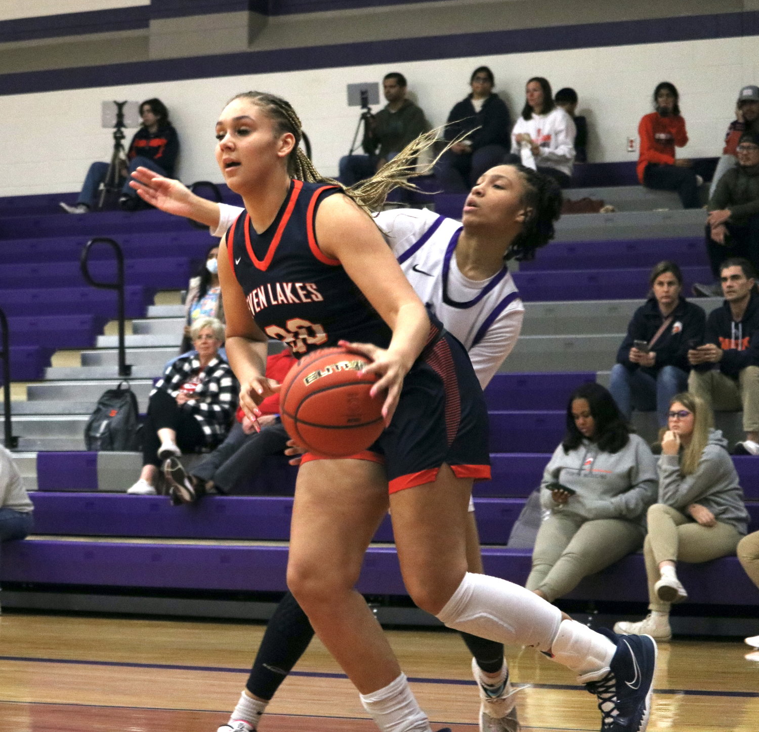 Justice Carlton drives past a defender during Friday's game between Seven Lakes and Morton Ranch at the Morton Ranch gym.