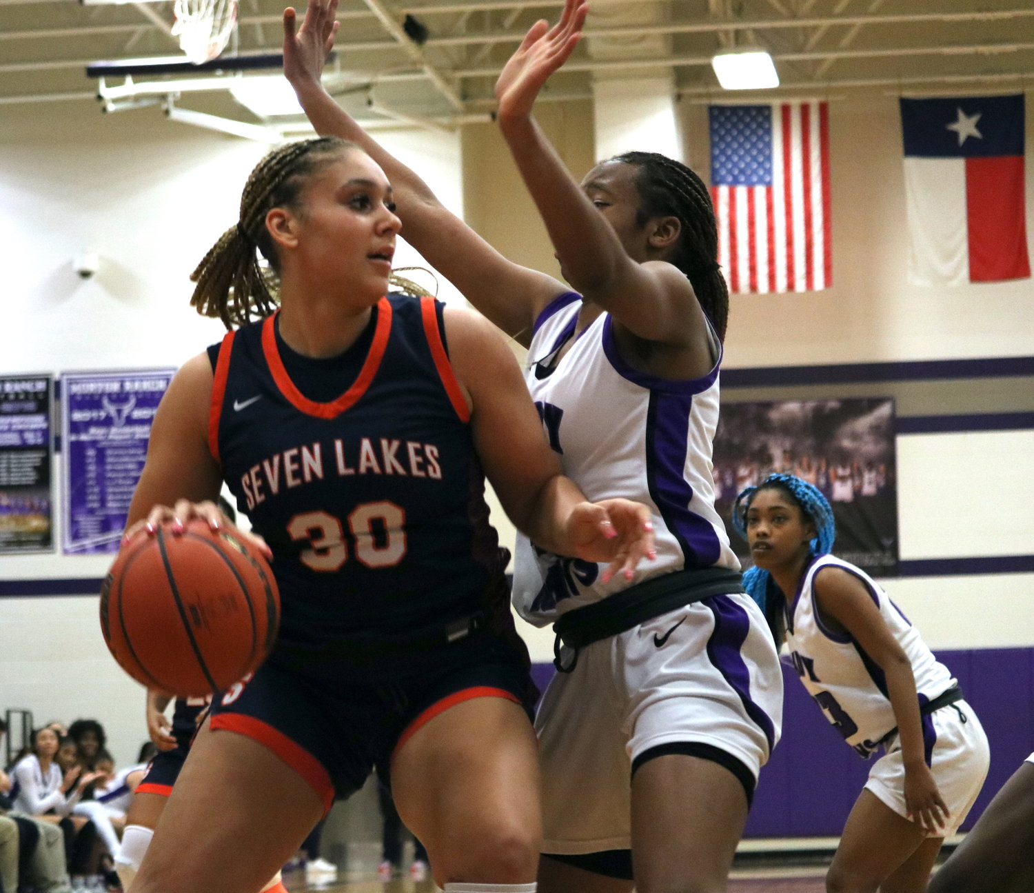 Justice Carlton backs down a defender during Friday's game between Seven Lakes and Morton Ranch at the Morton Ranch gym.