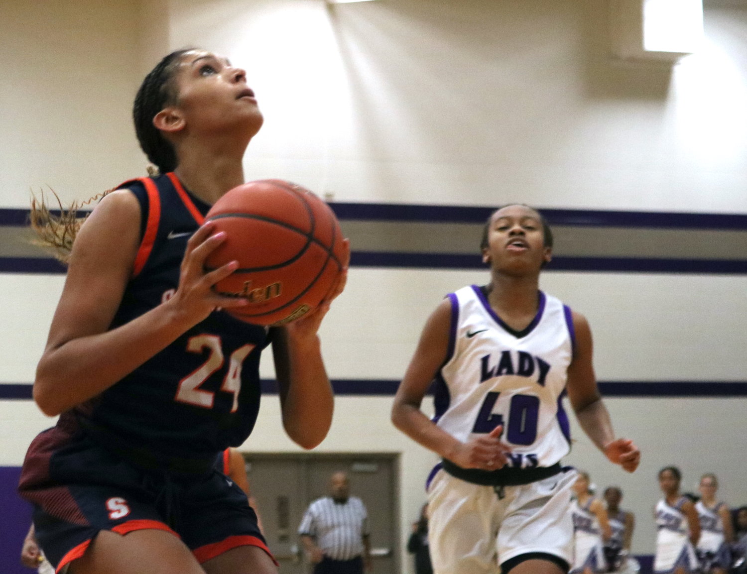 Madison Carlton goes up for a layup during Friday's game between Seven Lakes and Morton Ranch at the Morton Ranch gym.
