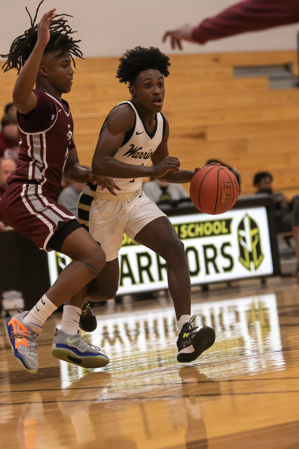Jaden Holt drives past a defender during Tuesday's game between Cinco Ranch and Jordan at the Jordan gym.