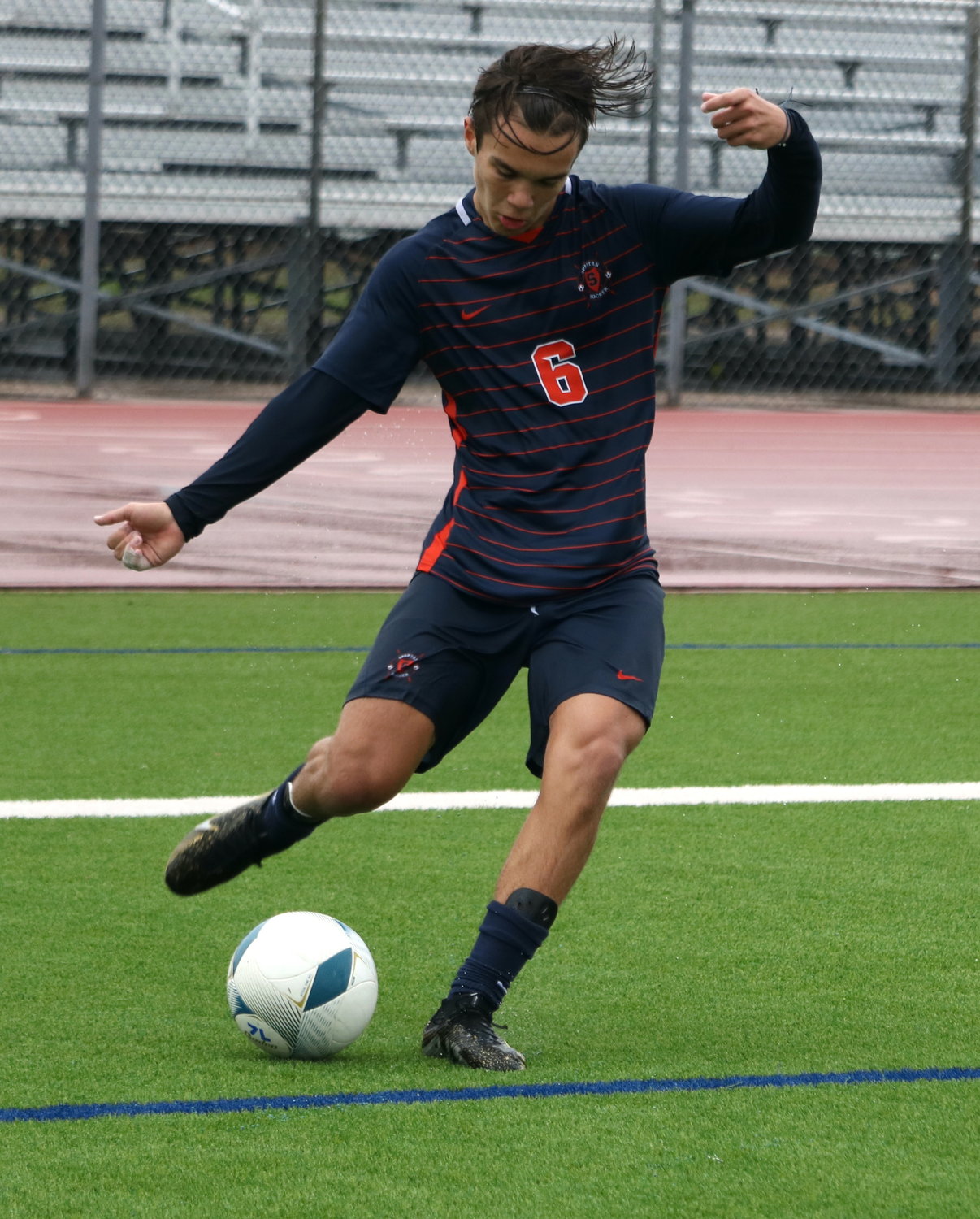 Kortay Koc crosses a ball during Saturday's game between Seven Lakes and Mayde Creek at the Seven Lakes soccer field.