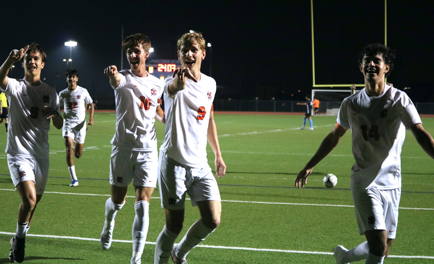 Seven Lakes players celebrate during Tuesday's District 19-6A game between Seven Lakes and Paetow at the Paetow soccer field.