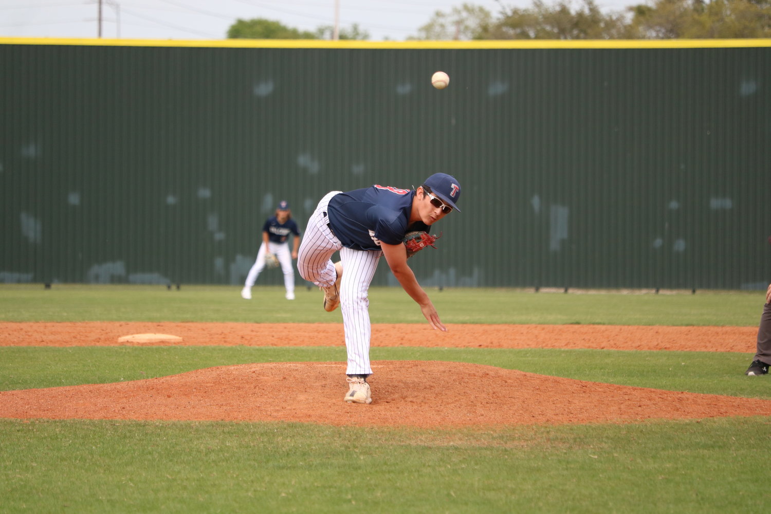 Daniel Deaton pitches during Tuesday's game between Tompkins and Cinco Ranch at the Cinco Ranch baseball field.
