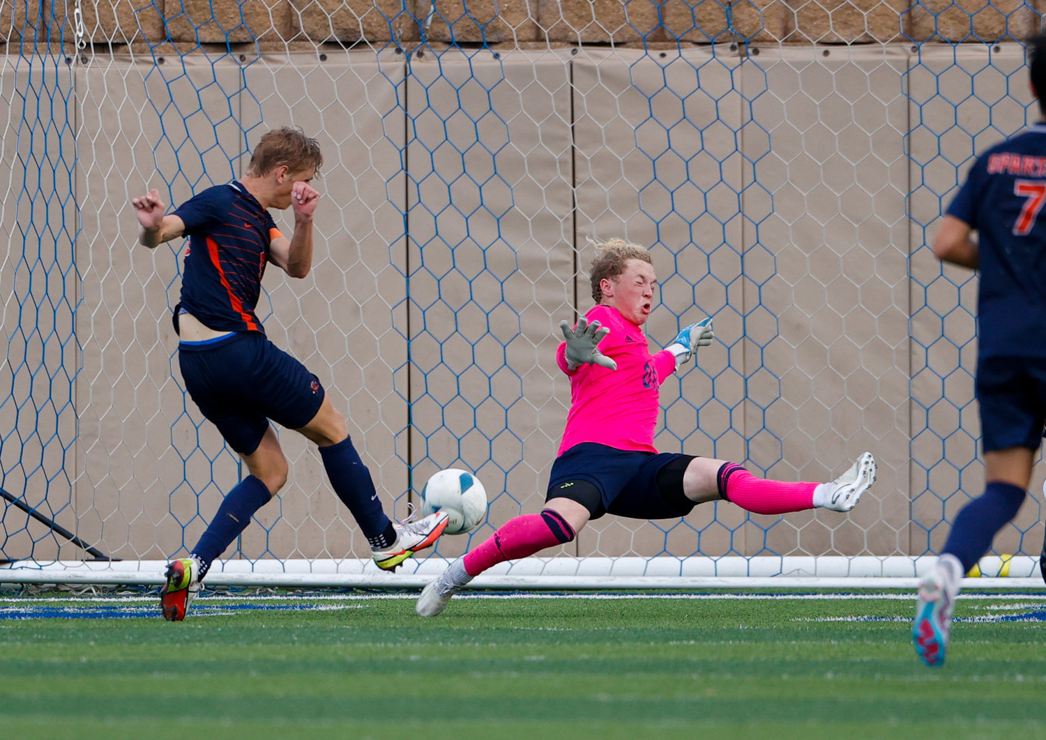 Seven Lakes forward Hunter Merritt (9) gets a ball past Sachse goalkeeper Josh Weston (00) in overtime of the Class 6A boys state semifinal soccer game between Seven Lakes and Sachse on April 14, 2023 in Georgetown.