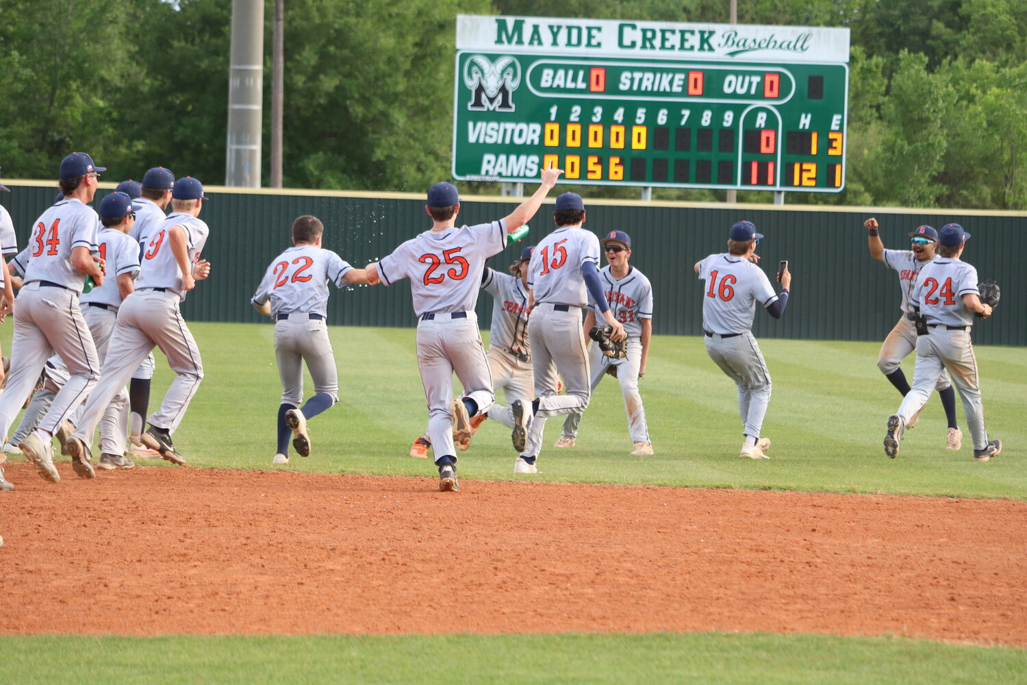 Seven Lakes players celebrate after winning Monday's District 19-6A play-in game between Seven Lakes and Taylor at the Mayde Creek baseball field.