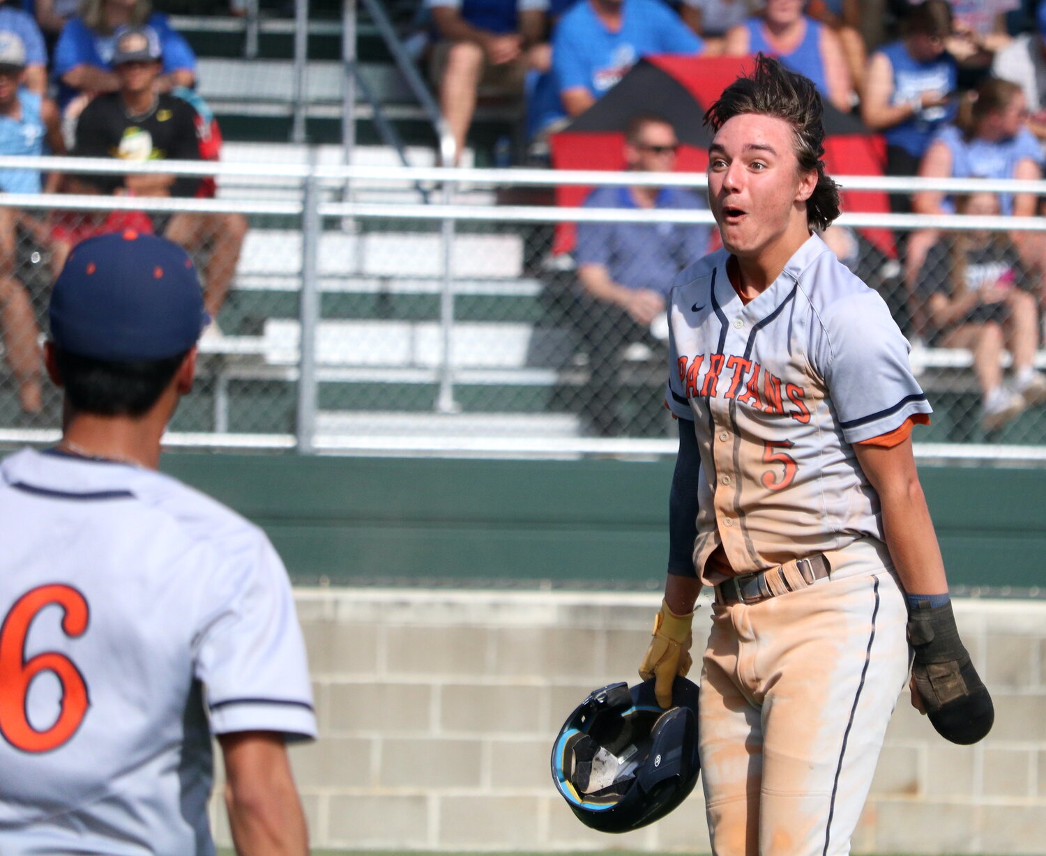 Jake Steffes celebrates after scoring a run during Monday's District 19-6A play-in game between Seven Lakes and Taylor at the Mayde Creek baseball field.
