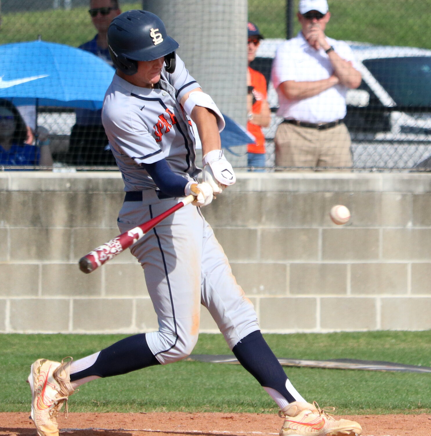 Nate Johnson hits during Monday's District 19-6A play-in game between Seven Lakes and Taylor at the Mayde Creek baseball field.