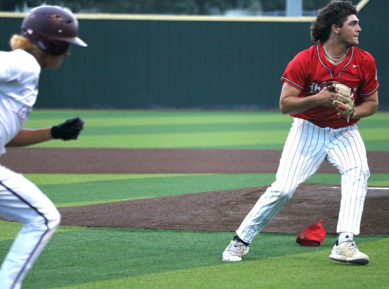 Cole Kaase throws a ball to first base during Friday's area round game between Katy and Cy-Fair at Langham Creek.