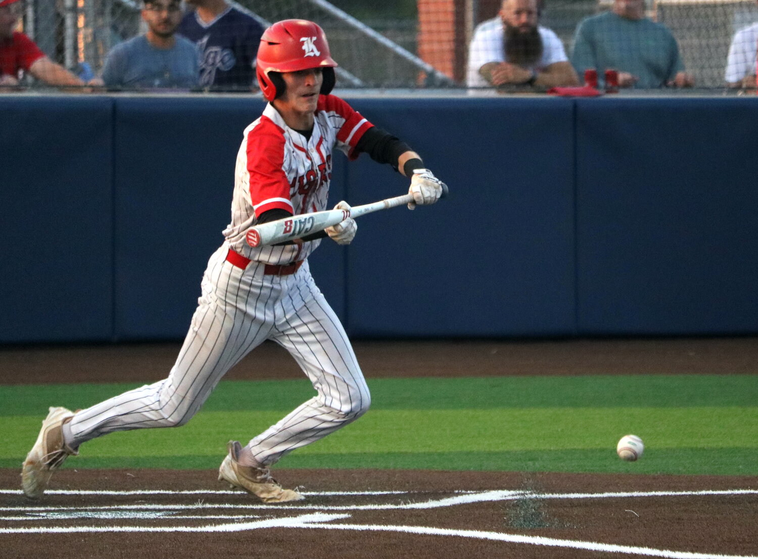 Josh Dunayczan bunts a run home during Thursday's Regional Quarterfinal game between Katy and Tompkins at Cy-Springs.