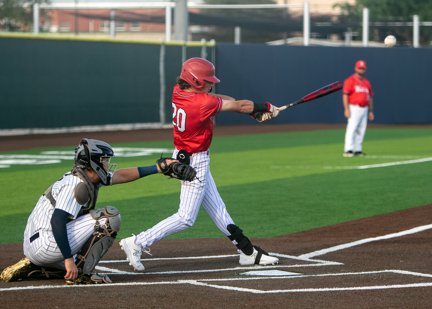 Sutton Hull hits during Saturday's Regional Quarterfinal between Katy and Tompkins at Cy-Springs.