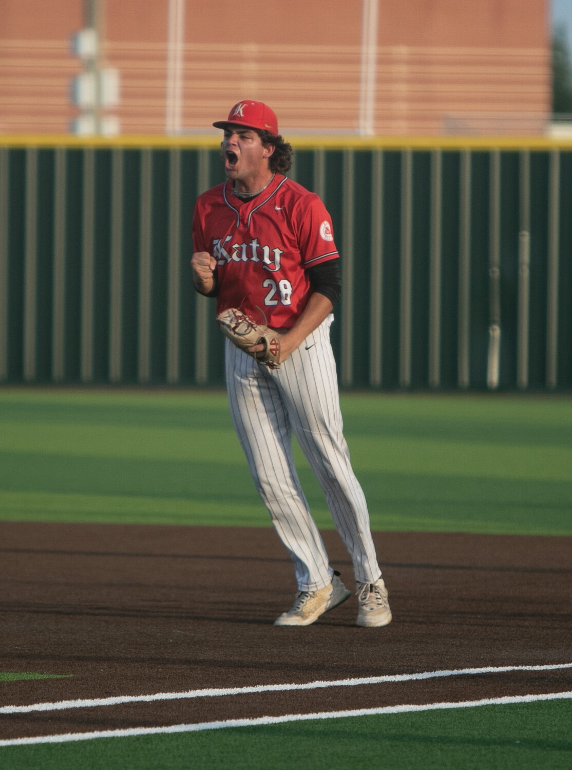 Coe Kaase celebrates after an out during Saturday's Regional Quarterfinal between Katy and Tompkins at Cy-Springs.