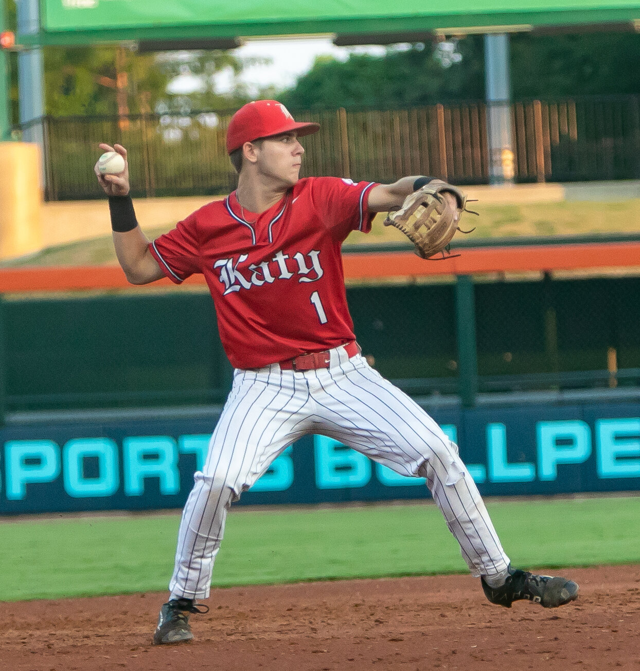 Graham Laxton throws to first base during Friday's Regional Final between Katy and Pearland at Constellation Field in Sugar Land.