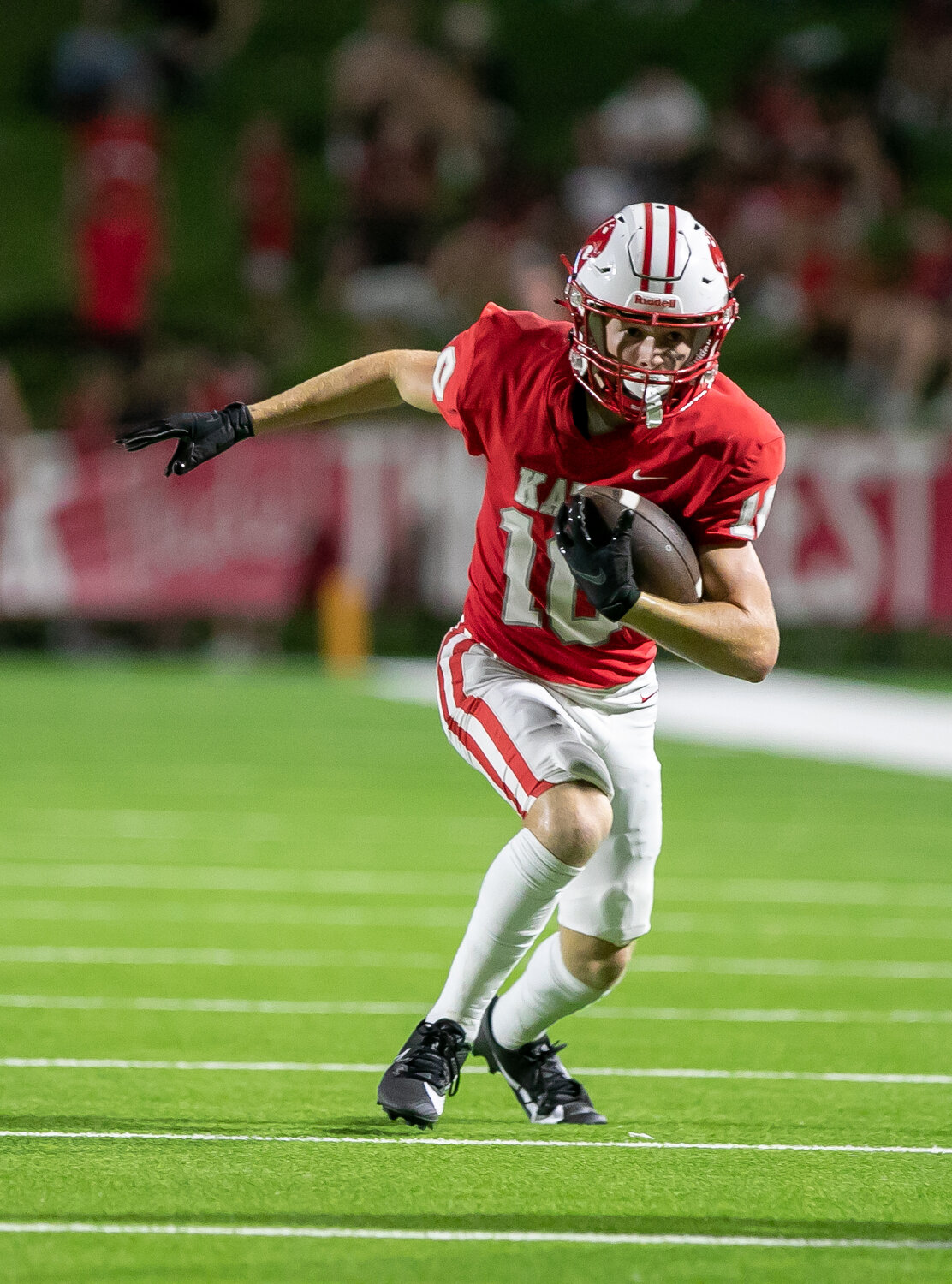 Oliver Ginn runs downfield after making a catch during Friday's game between Katy and Tompkins at Rhodes Stadium.
