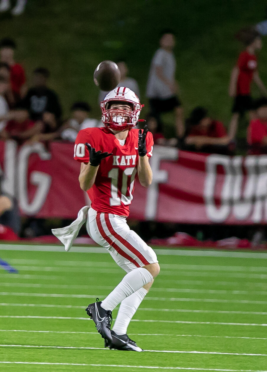 Oliver Ginn makes a catch during Friday's game between Katy and Tompkins at Rhodes Stadium.