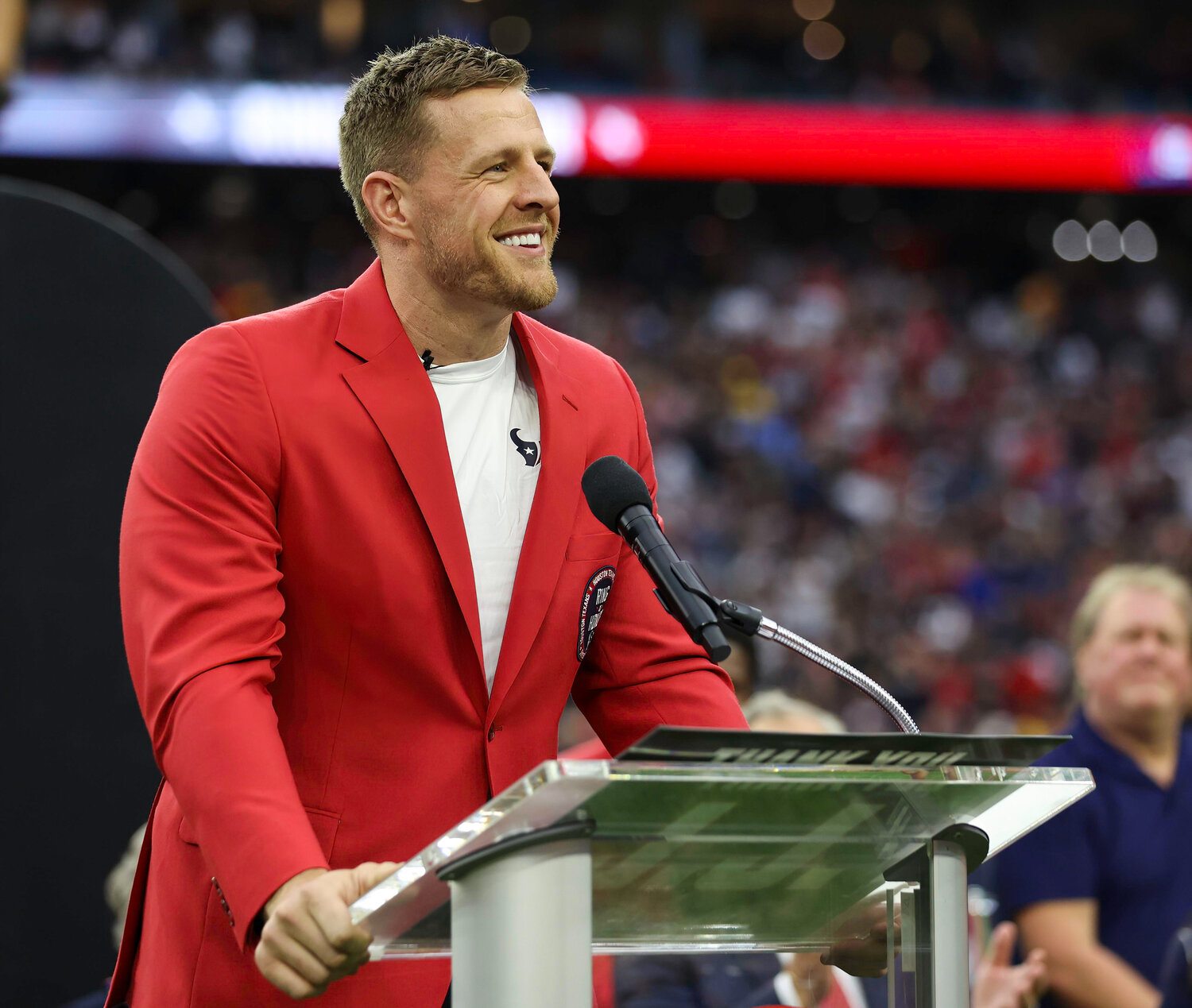 Former Houston Texans player JJ Watt speaks during an induction ceremony to the Texans’ Ring of Honor at halftime during an NFL game between the Texans and the Steelers on October 1, 2023 in Houston.