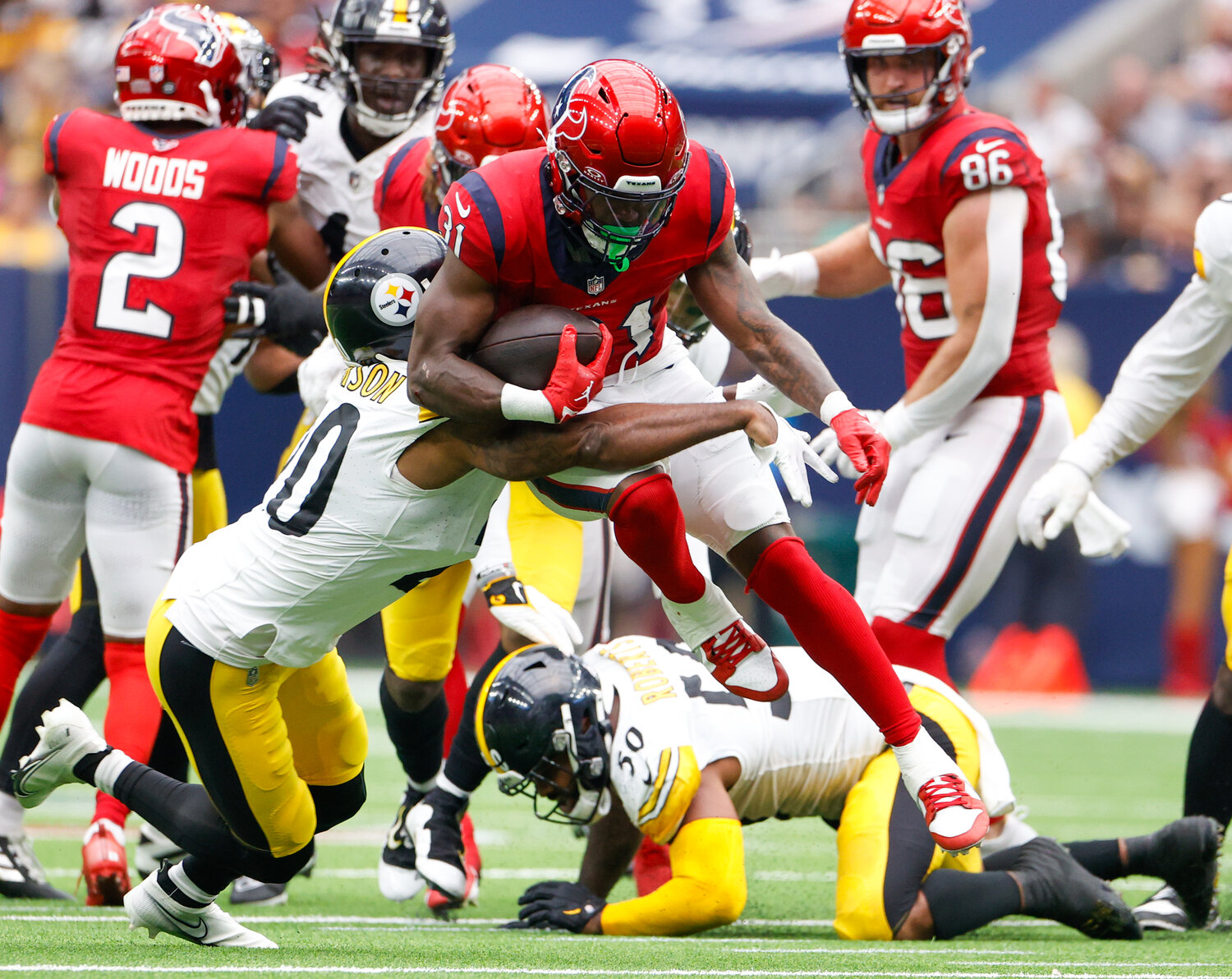 Texans running back Dameon Pierce (31) carries the ball during an NFL game between the Houston Texans and the Pittsburgh Steelers on October 1, 2023 in Houston.