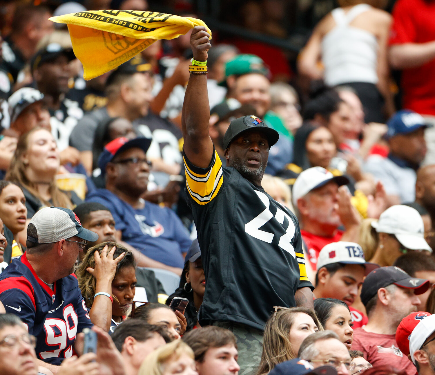 A Pittsburg Steelers fan waves his “Terrible Towel” during an NFL game between the Texans and the Steelers on October 1, 2023 in Houston.
