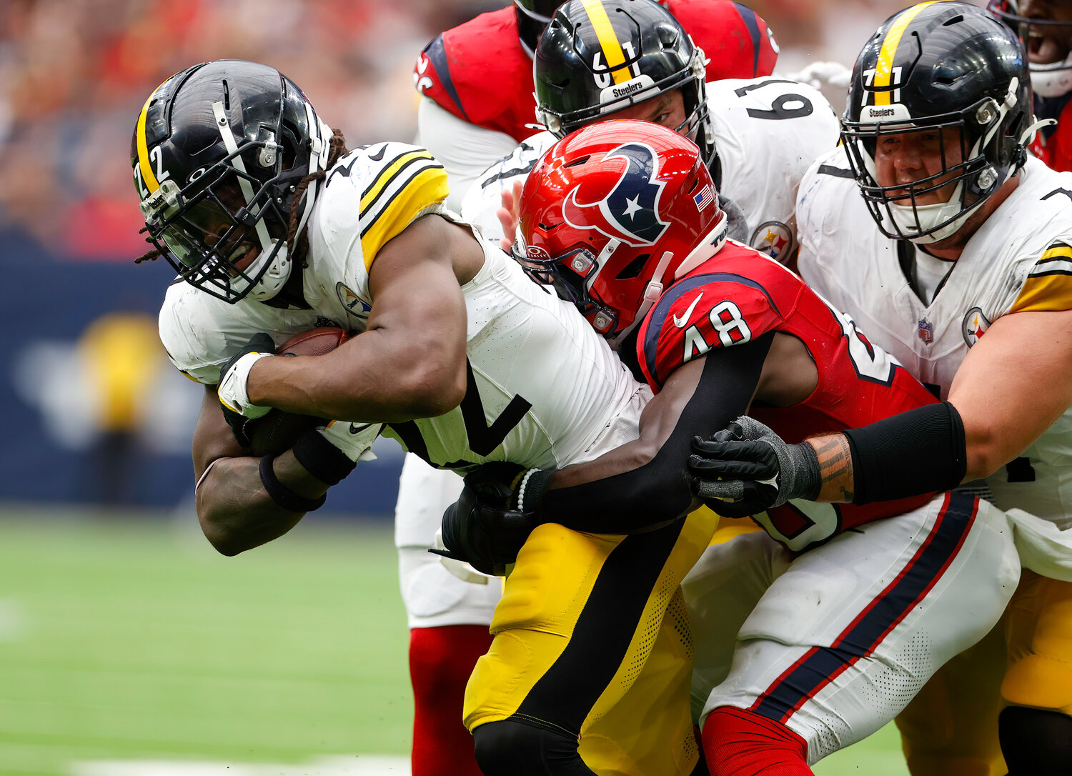 Steelers running back Najee Harris (22) is tackled on a carry during an NFL game between the Houston Texans and the Pittsburgh Steelers on October 1, 2023 in Houston.