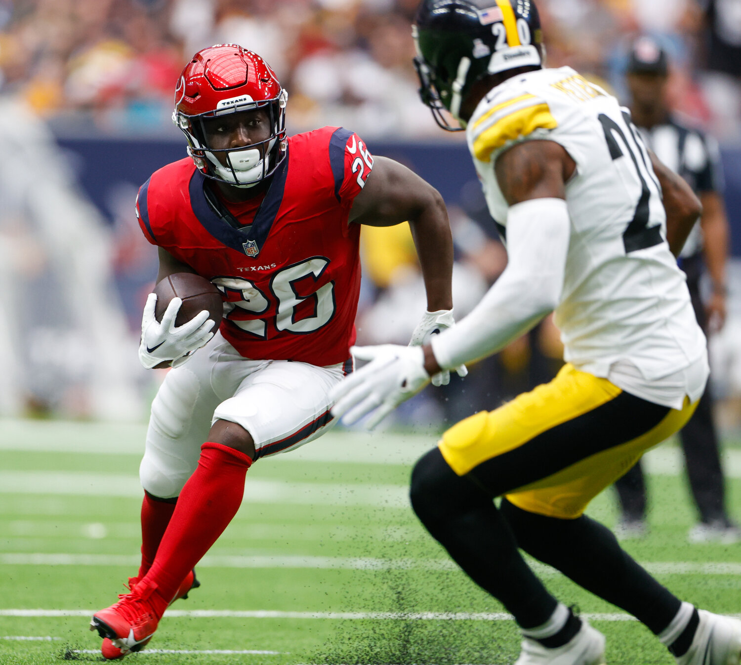 Texans running back Devin Singletary (26) carries the ball during an NFL game between the Houston Texans and the Pittsburgh Steelers on October 1, 2023 in Houston.