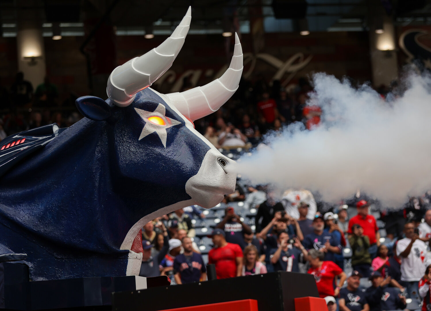 The Houston Texans run onto the field under an animatronic bull during an NFL between the Texans and the Saints on October 15, 2023 in Houston. The Texans won, 20-13.