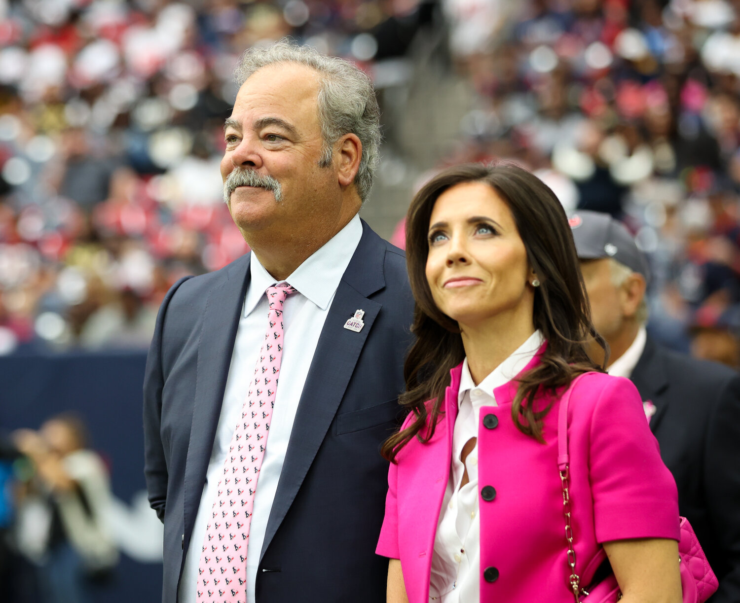 Houston Texans CEO and Chairman CAL MCNAIR stands with his wife, HANNAH MCNAIR, on the sidelines during an NFL game between the Texans and the Saints on October 15, 2023 in Houston. The Texans won, 20-13.
