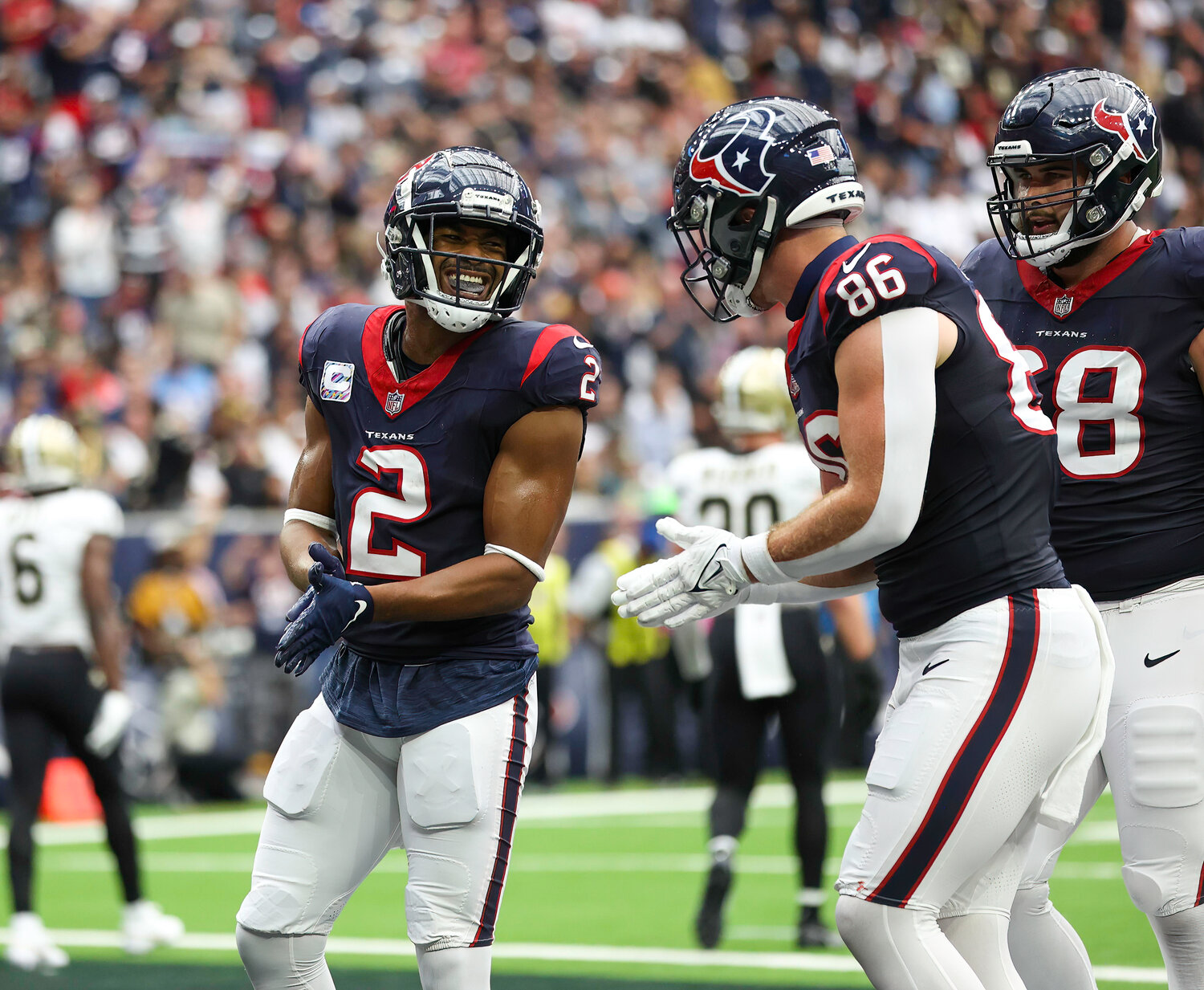 Texans wide receiver Robert Woods (2) celebrates after making a touchdown catch during an NFL game between the Texans and the Saints on October 15, 2023 in Houston. The Texans won, 20-13.