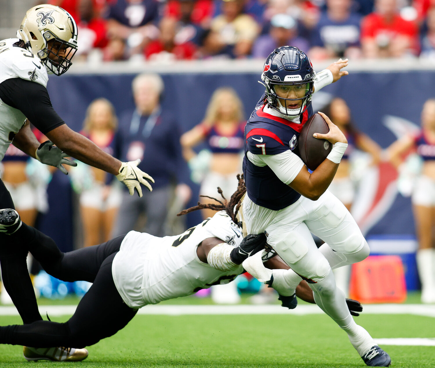 Texans quarterback C.J. Stroud (7) is sacked by Saints defensive end Carl Granderson (96) during an NFL game between the Texans and the Saints on October 15, 2023 in Houston. The Texans won, 20-13.