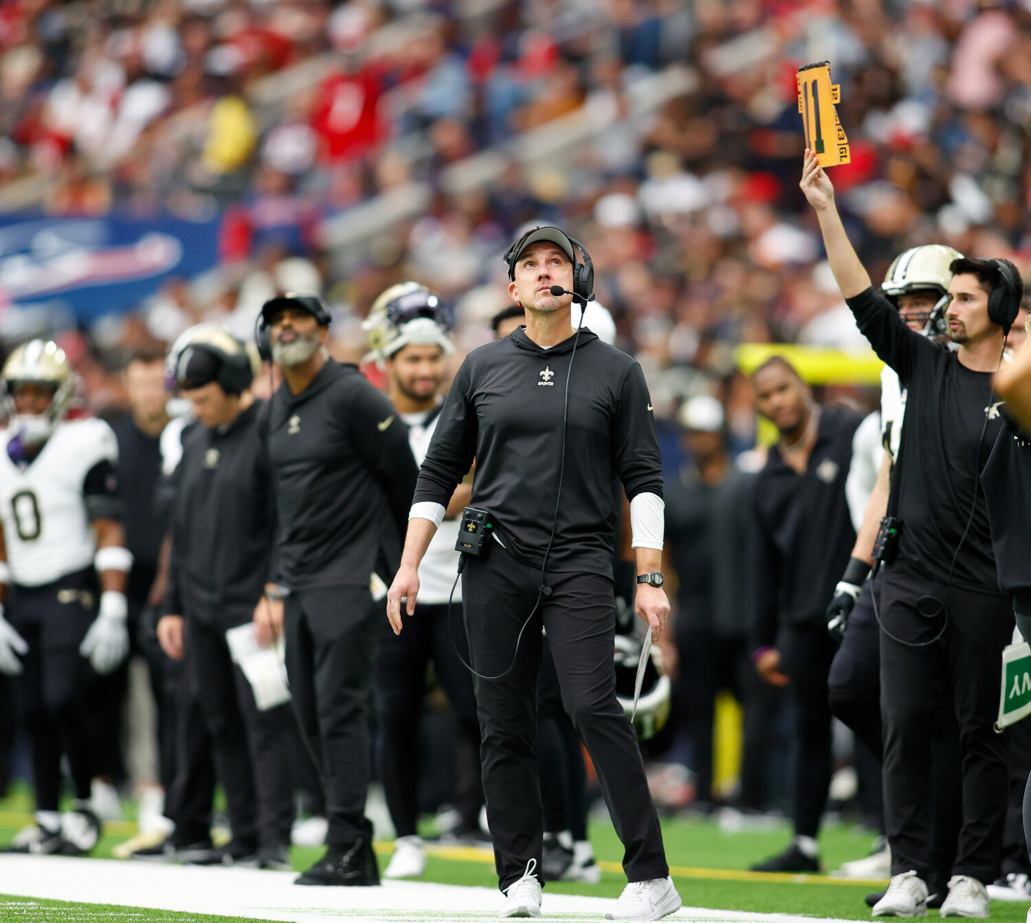 Saints head coach Dennis Allen looks up at a replay on the video board during an NFL game between the Texans and the Saints on October 15, 2023 in Houston. The Texans won, 20-13.