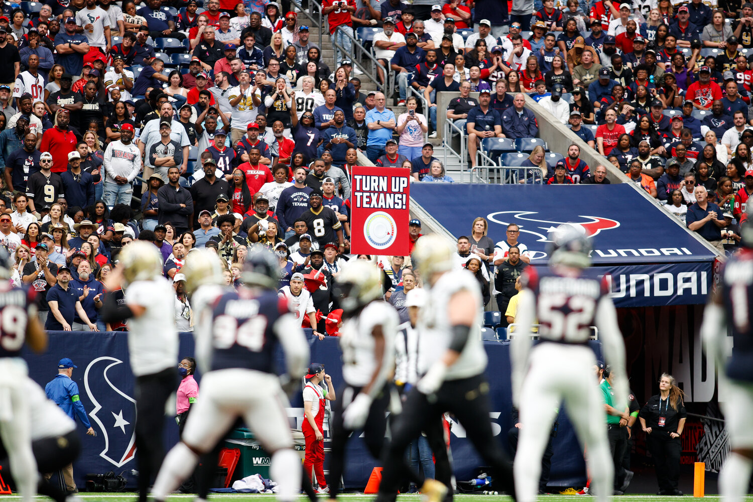 Texans fans cheer during the Saints’ last-chance drive late in the fourth quarter of an NFL game between the Texans and the Saints on October 15, 2023 in Houston. The Texans won, 20-13.