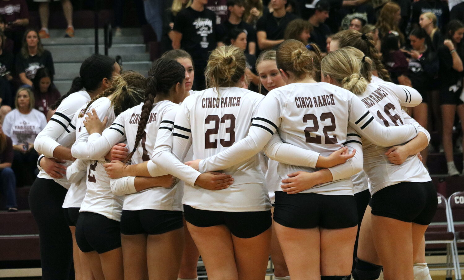 Cinco Ranch huddles before a match between Cinco ranch and Seven Lakes at the Cinco Ranch gym.