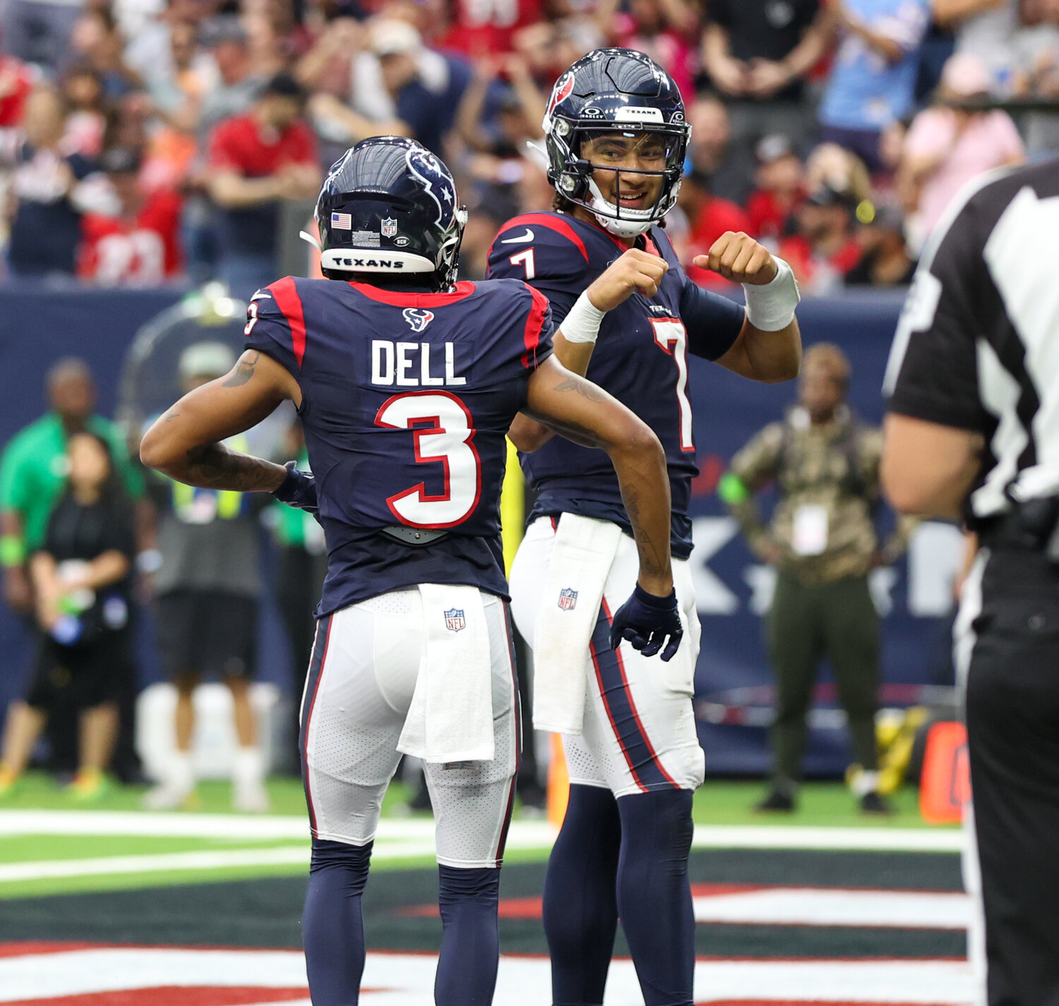 Texans quarterback C.J. Stroud (7) celebrates with wide receiver Tank Dell (3) after scoring on a two-point conversion play in the fourth quarter of an NFL game between the Houston Texans and the Tampa Bay Buccaneers on November 5, 2023 in Houston.
