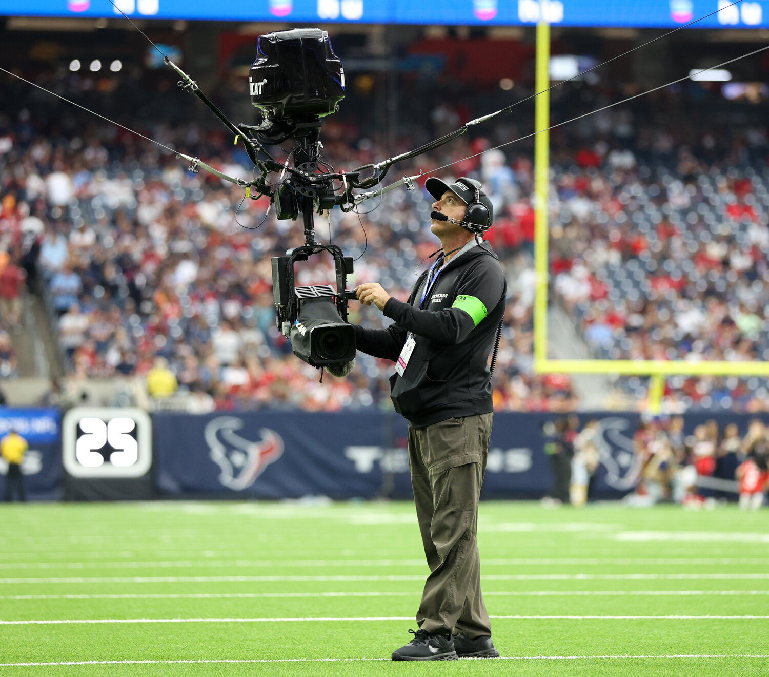 A camera operator checks the skycam during halftime in an NFL game between the Houston Texans and the Tampa Bay Buccaneers on November 5, 2023 in Houston.