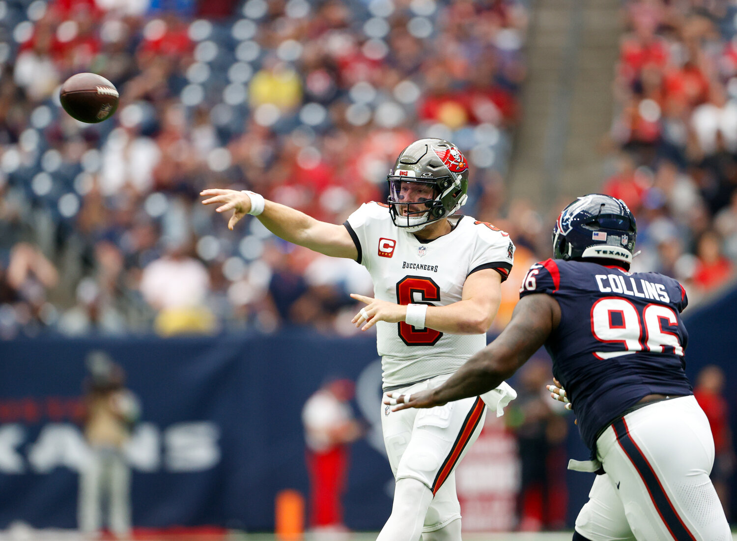 Buccaneers quarterback Baker Mayfield (6) passes the ball under pressure from Texans defensive tackle Maliek Collins (96) during an NFL game between the Houston Texans and the Tampa Bay Buccaneers on November 5, 2023 in Houston.