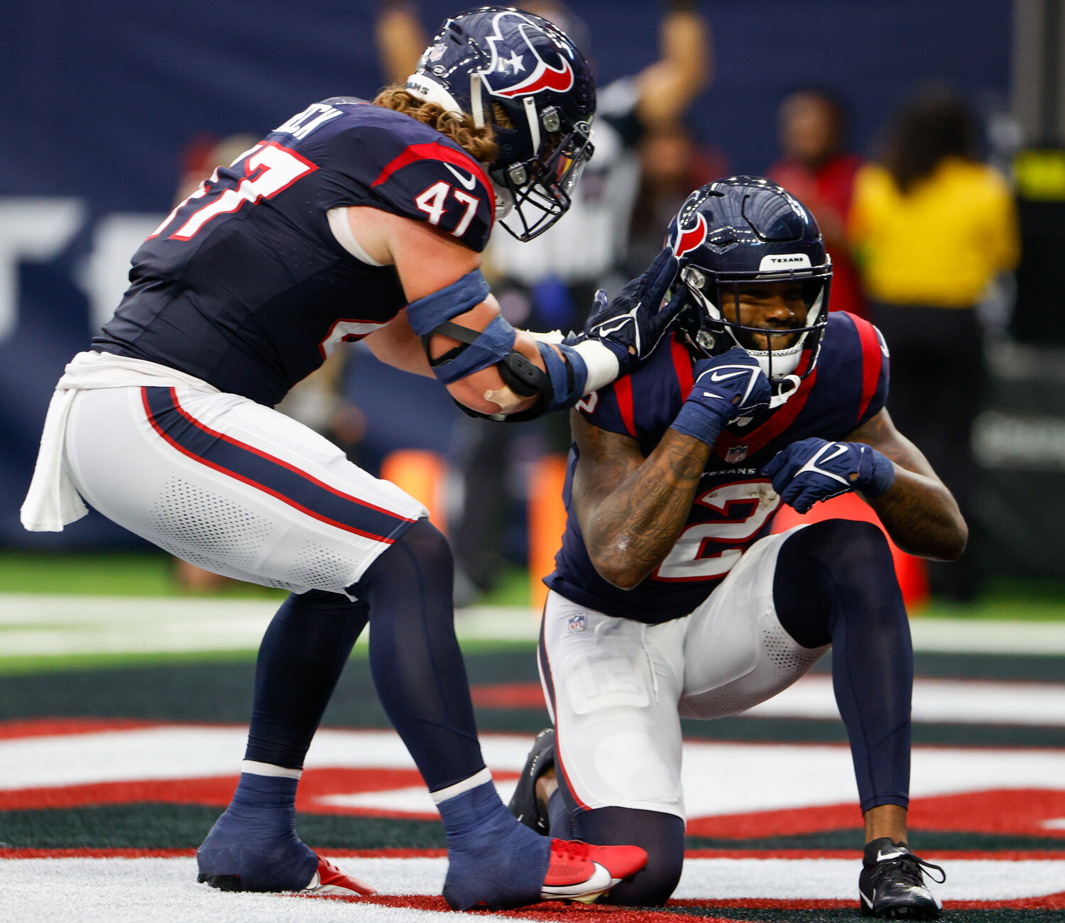 Texans fullback Andrew Beck (47) congratulates wide receiver Nico Collins (12) after a touchdown catch during an NFL game between the Houston Texans and the Tampa Bay Buccaneers on November 5, 2023 in Houston.