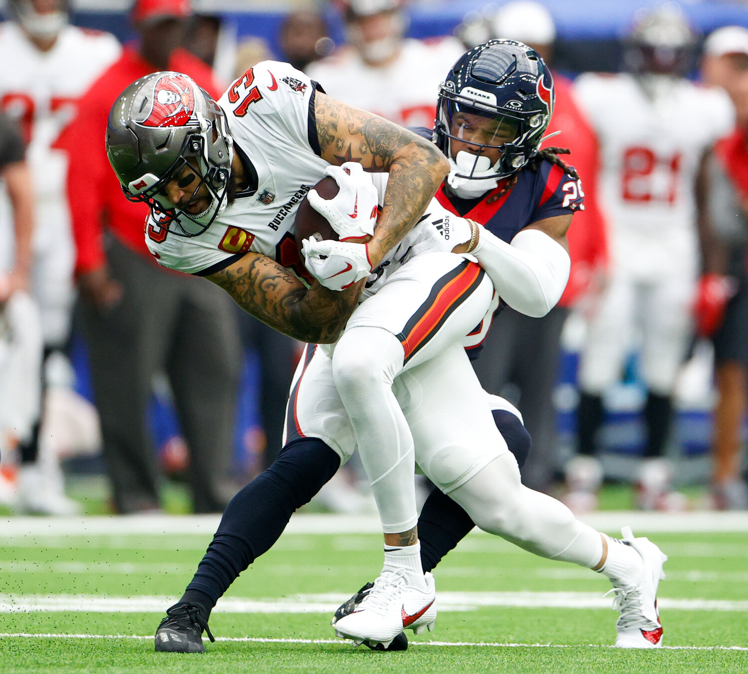Texans safety M.J. Stewart (29) tackles Buccaneers wide receiver Mike Evans (13) after a catch during an NFL game between the Houston Texans and the Tampa Bay Buccaneers on November 5, 2023 in Houston.