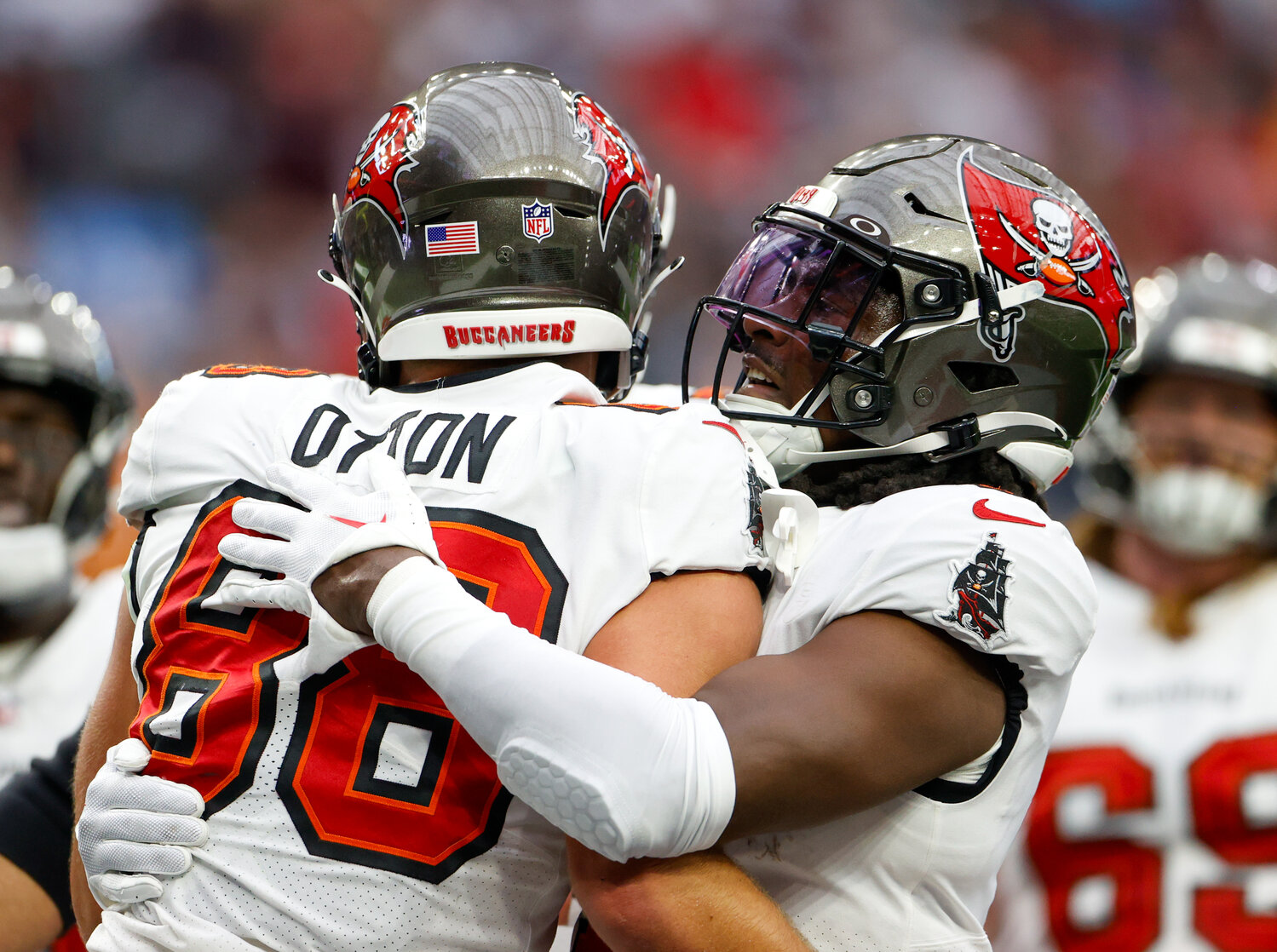 Teammates congratulate Buccaneers tight end Cade Otton (88) after a touchdown catch during an NFL game between the Houston Texans and the Tampa Bay Buccaneers on November 5, 2023 in Houston.
