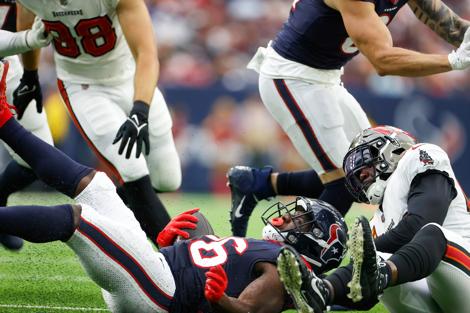 Texans running back Devin Singletary (26) is tackled on a carry during an NFL game between the Houston Texans and the Tampa Bay Buccaneers on November 5, 2023 in Houston.