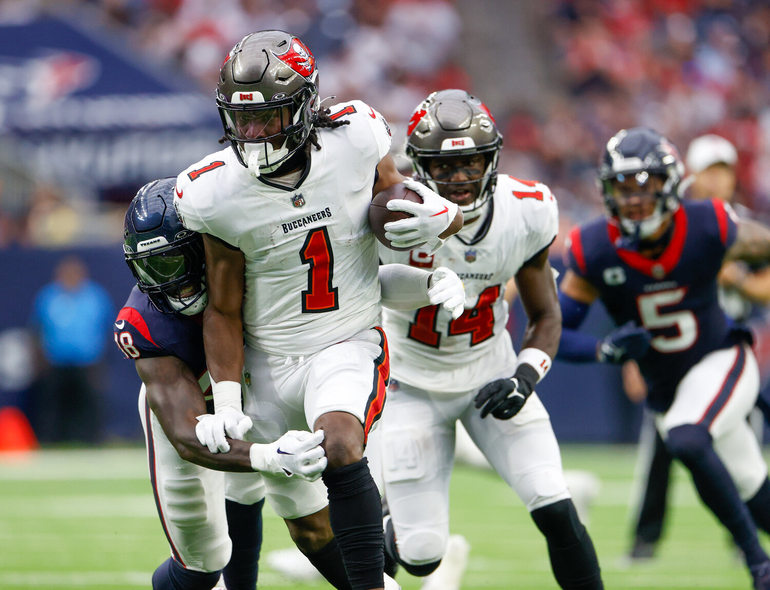 Buccaneers running back Rachaad White (1) is tackled on a carry during an NFL game between the Houston Texans and the Tampa Bay Buccaneers on November 5, 2023 in Houston.