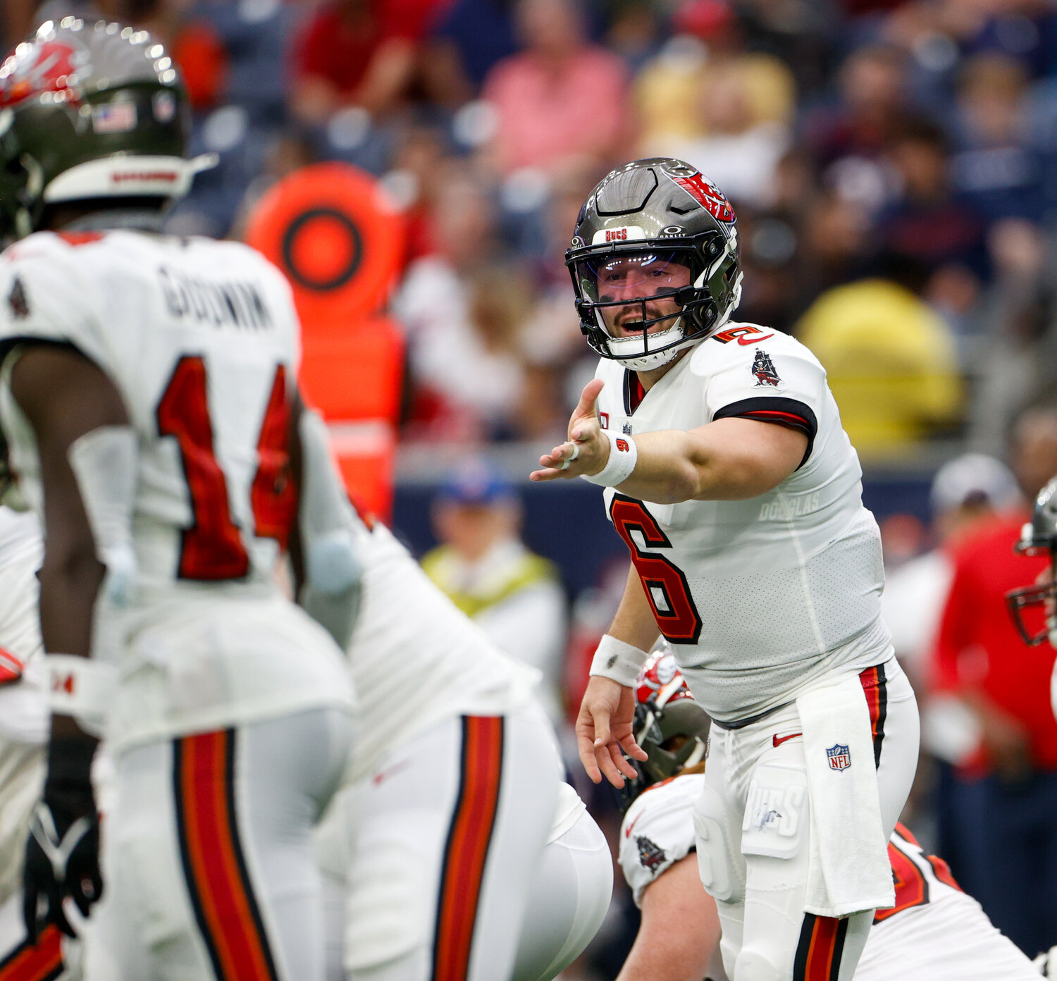Buccaneers quarterback Baker Mayfield (6) gestures to wide receiver Chris Godwin (14) at the line of scrimmage during an NFL game between the Houston Texans and the Tampa Bay Buccaneers on November 5, 2023 in Houston.